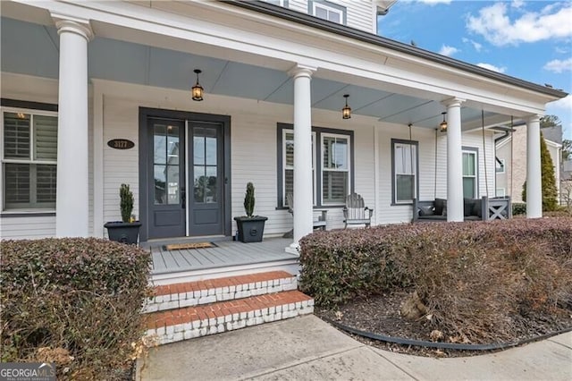 entrance to property featuring a porch