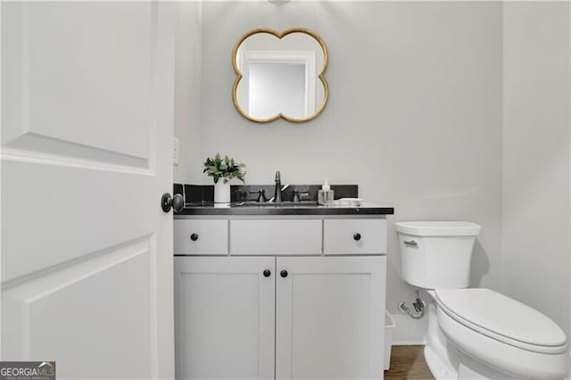 bathroom with vanity and toilet