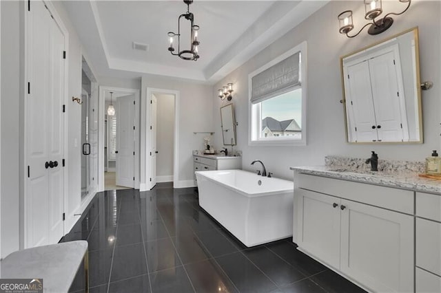 bathroom with separate shower and tub, vanity, a raised ceiling, and tile patterned flooring