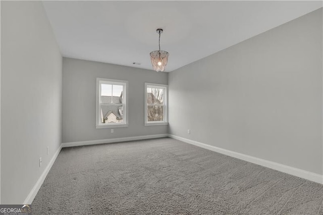 spare room featuring carpet floors