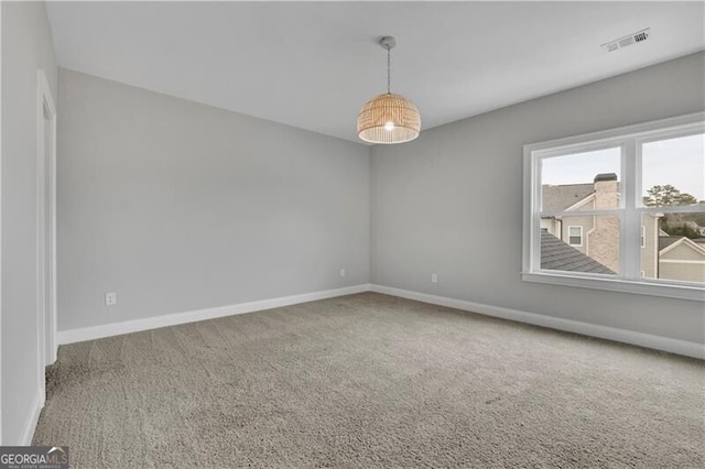 unfurnished room with carpet floors