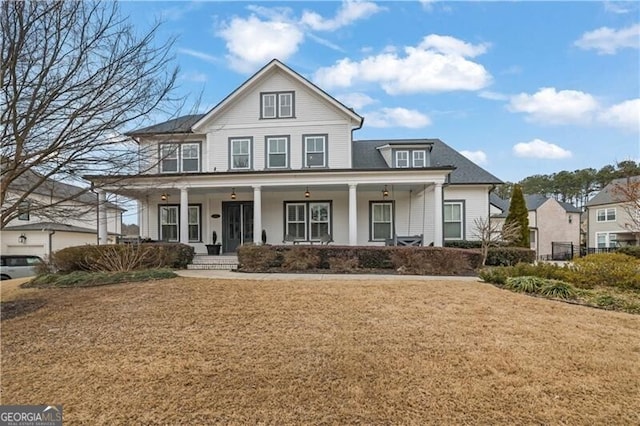 view of front facade with a front yard and a porch