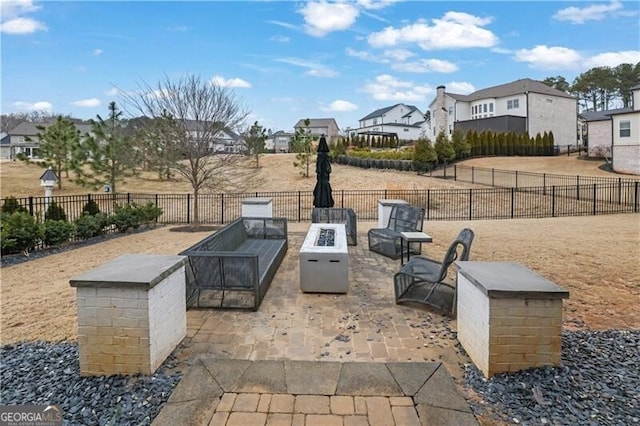 view of patio with an outdoor fire pit