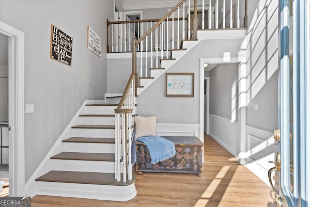 stairs featuring hardwood / wood-style flooring