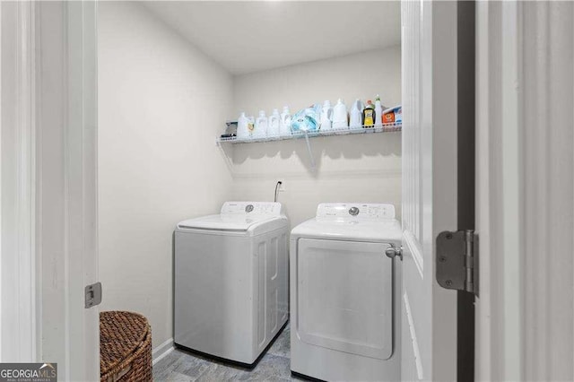 laundry room with independent washer and dryer