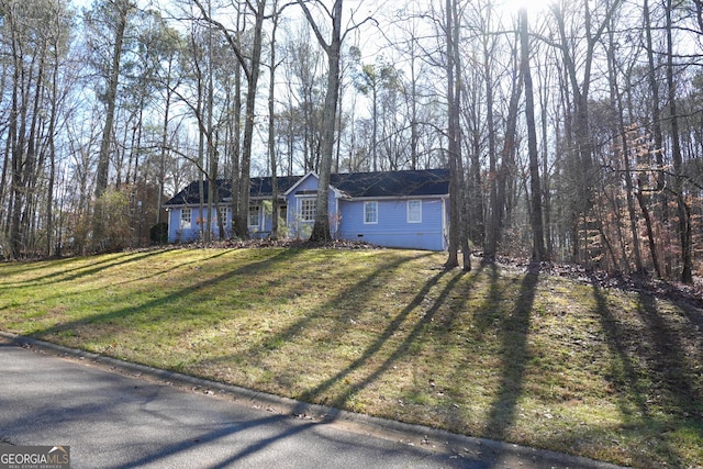 ranch-style home featuring a front yard