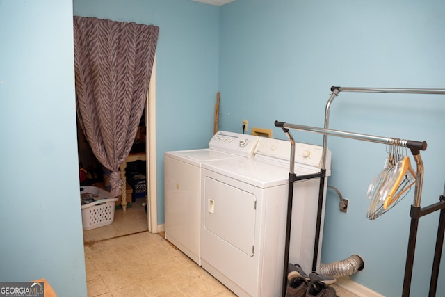 clothes washing area featuring washer and dryer