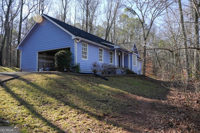 single story home with a garage and a front yard