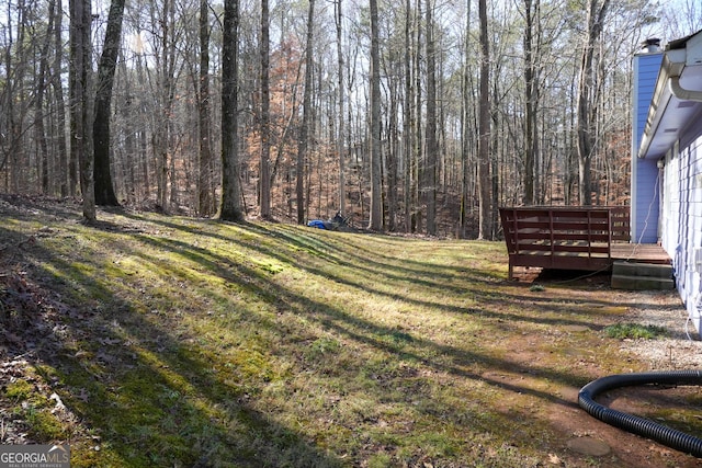 view of yard with a wooden deck