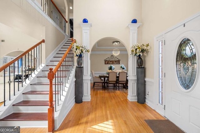 foyer featuring light hardwood / wood-style floors and ornamental molding