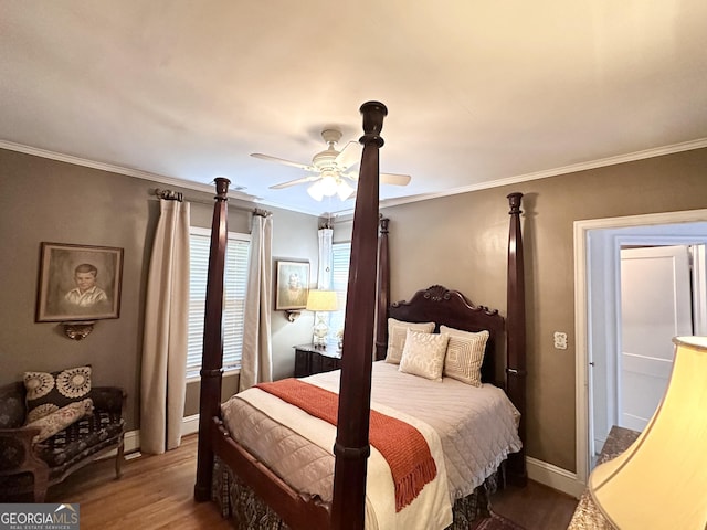 bedroom with hardwood / wood-style flooring, ornamental molding, and ceiling fan