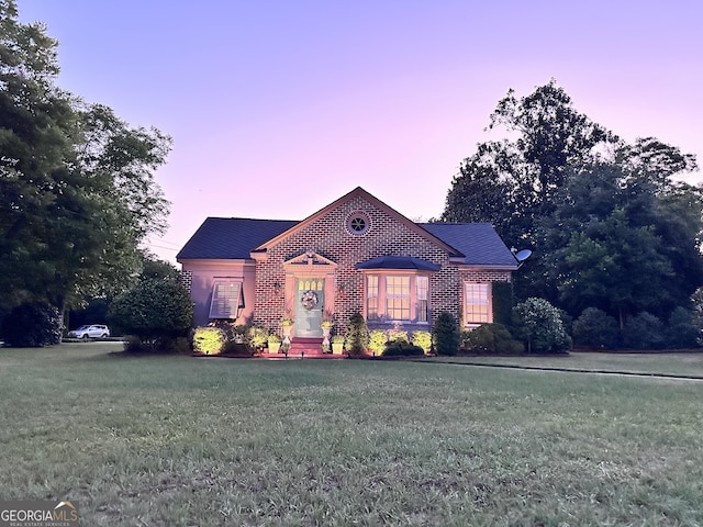 view of front of home with a lawn