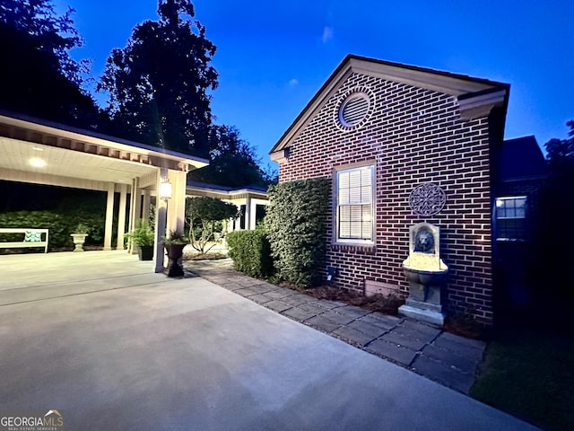 view of property exterior with a patio