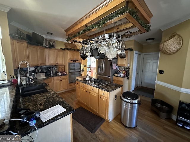 kitchen featuring a center island, black appliances, sink, light brown cabinetry, and dark hardwood / wood-style flooring