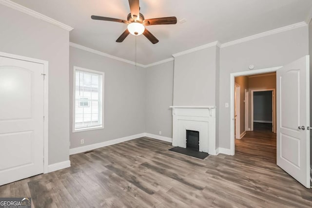 unfurnished living room featuring dark hardwood / wood-style flooring, ceiling fan, and crown molding