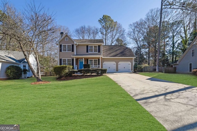 colonial inspired home featuring a chimney, concrete driveway, a front yard, fence, and a garage