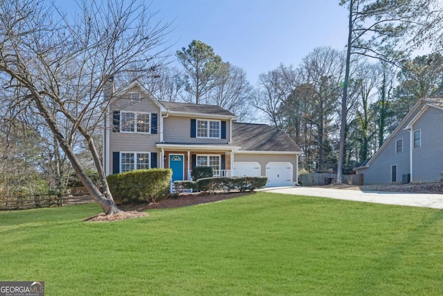 view of front of home with a garage, concrete driveway, and a front lawn