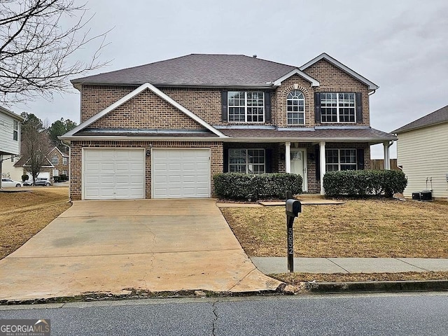 view of front facade featuring covered porch, a front lawn, and a garage