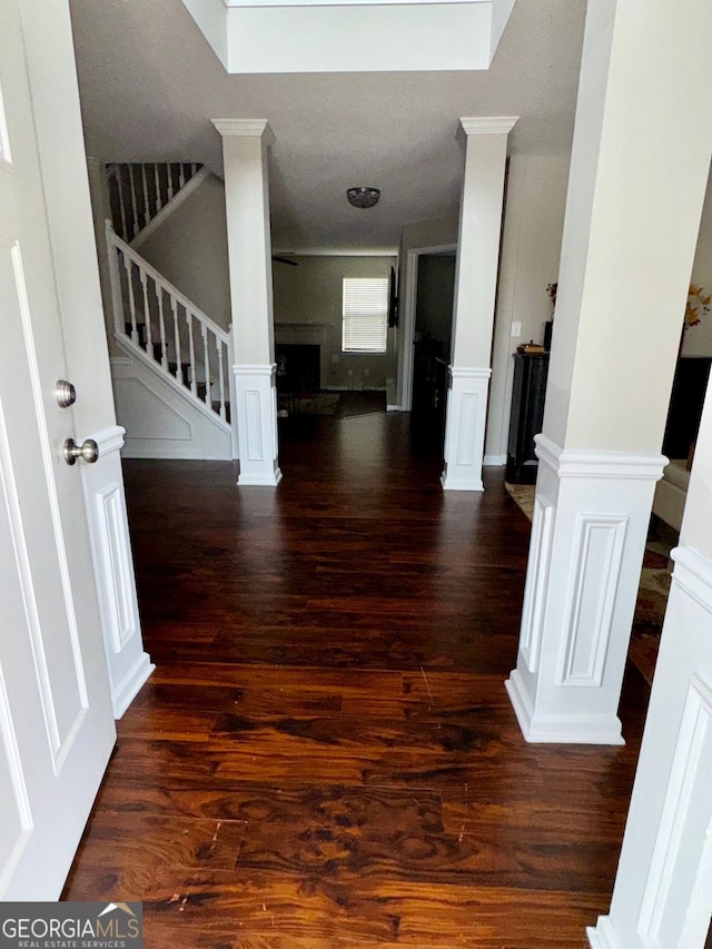 hallway with dark hardwood / wood-style floors