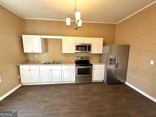 kitchen with white cabinets, sink, hanging light fixtures, dark hardwood / wood-style floors, and stainless steel appliances