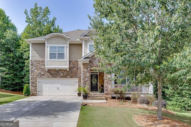 view of front of house featuring a front yard and a garage