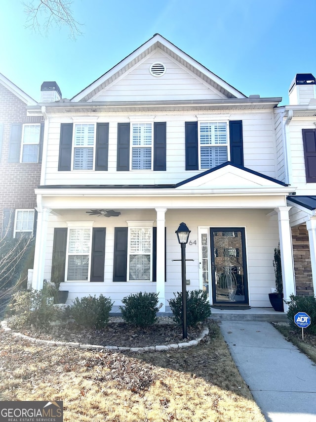 greek revival house featuring covered porch