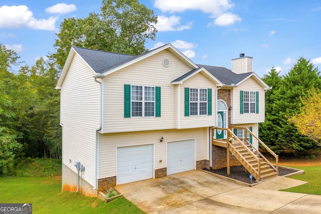 bi-level home featuring a garage