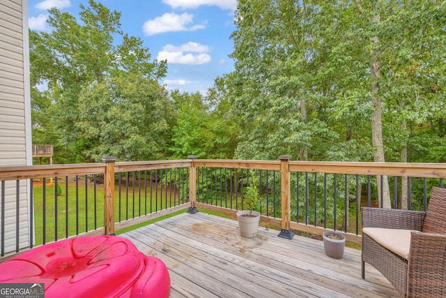 deck featuring a lawn