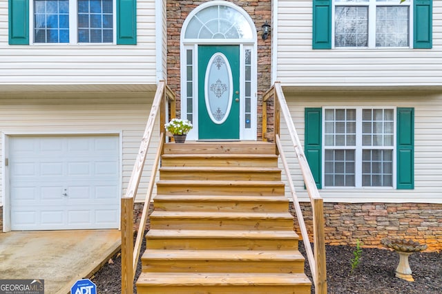 doorway to property featuring a garage