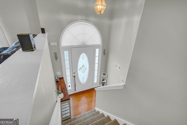 foyer entrance with hardwood / wood-style floors