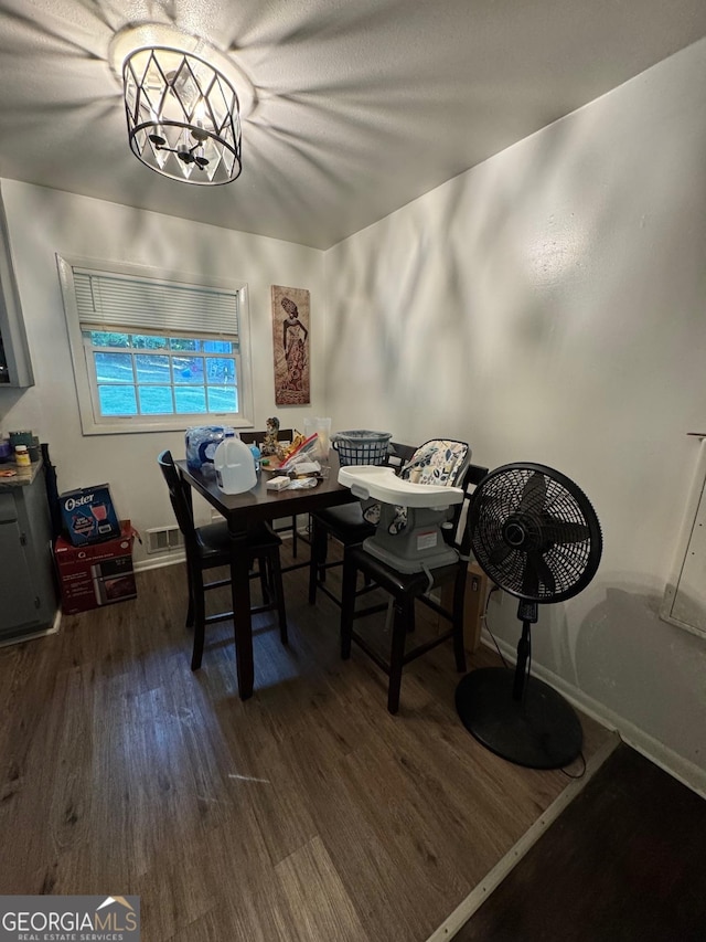 dining space featuring dark hardwood / wood-style flooring