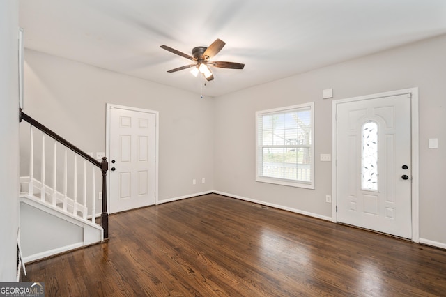 foyer with dark hardwood / wood-style floors and ceiling fan