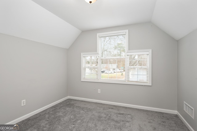 bonus room featuring lofted ceiling and carpet floors