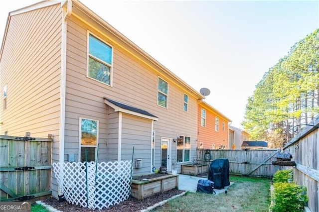 back of house with a patio area