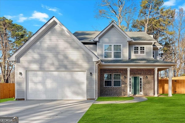 view of front of property with a garage and a front lawn