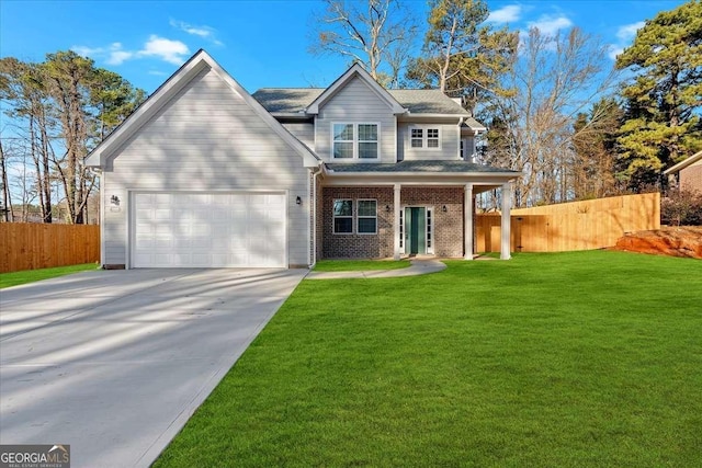 view of front of house featuring a front lawn and a garage