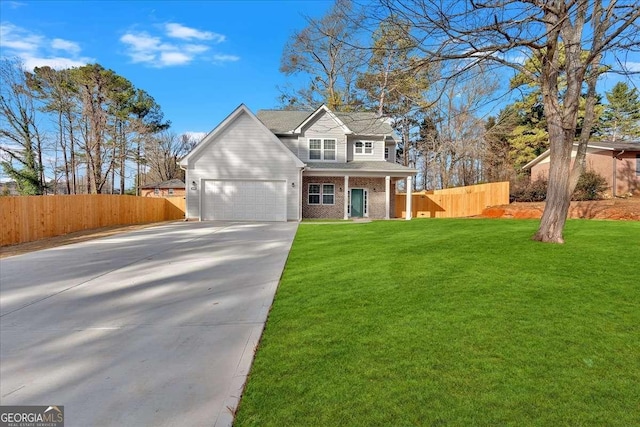 view of property featuring a front yard and a garage