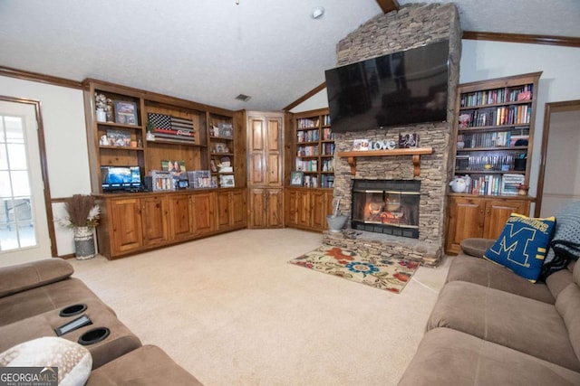 carpeted living room featuring vaulted ceiling with beams, ornamental molding, a fireplace, and built in shelves