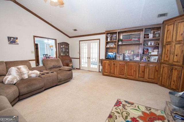 living room with light carpet, french doors, ceiling fan, and lofted ceiling