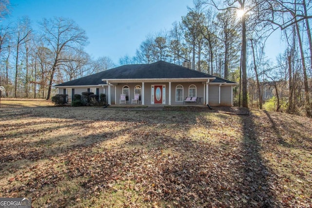 single story home featuring covered porch