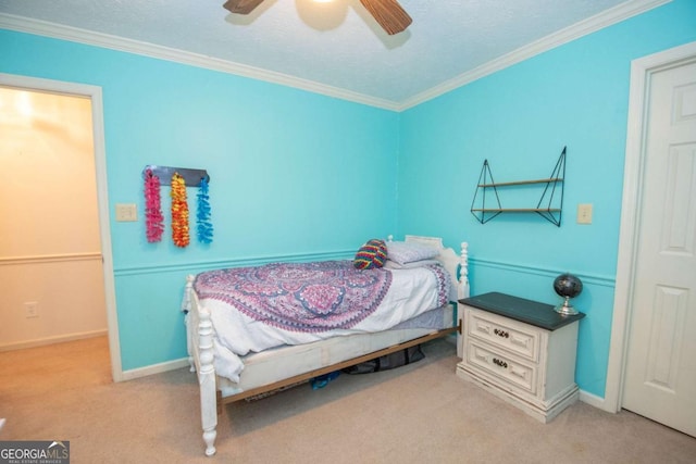 bedroom featuring ceiling fan, light colored carpet, ornamental molding, and a textured ceiling