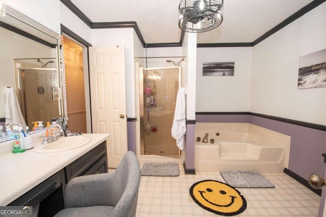 bathroom with vanity, crown molding, and shower with separate bathtub