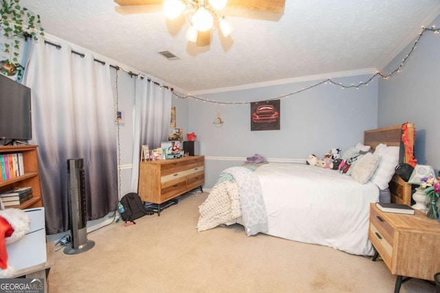 bedroom featuring ceiling fan, light colored carpet, and a textured ceiling