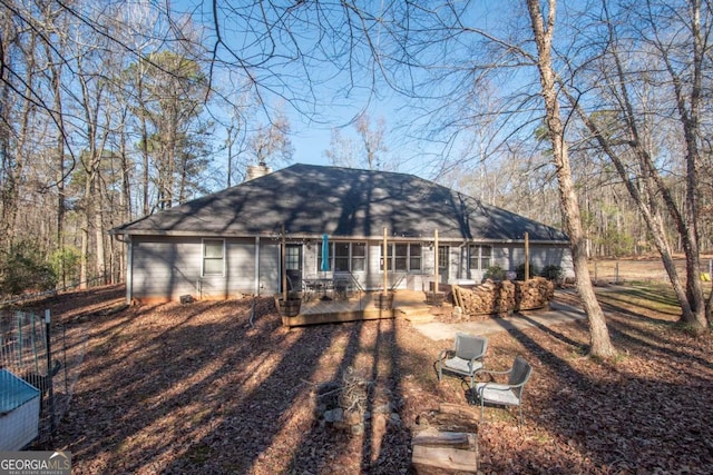 rear view of property with a deck