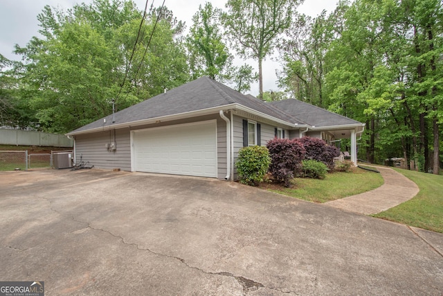 306 Washington Way, Lagrange, GA 30240 - view of side of property with driveway, fence, central air condition unit, and a garage