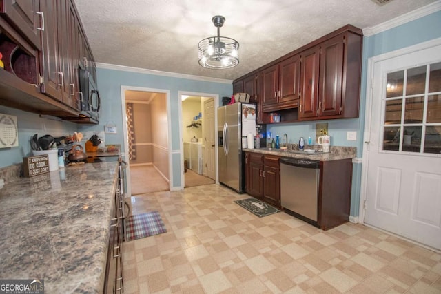 kitchen with a textured ceiling, decorative light fixtures, crown molding, and appliances with stainless steel finishes