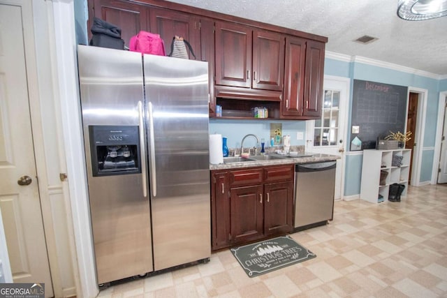 306 Washington Way, Lagrange, GA 30240 - kitchen featuring stainless steel appliances, a sink, light floors, ornamental molding, and a textured ceiling