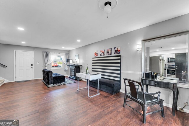 office with dark hardwood / wood-style floors