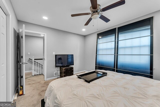 carpeted bedroom with ceiling fan