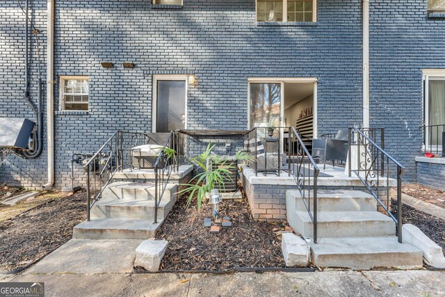 doorway to property with a patio